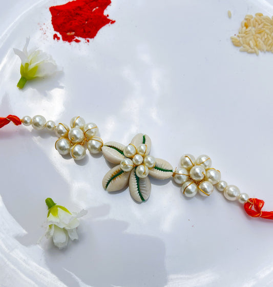 PREMIUM PEARL AND KAUDI FLOWER RAKHI