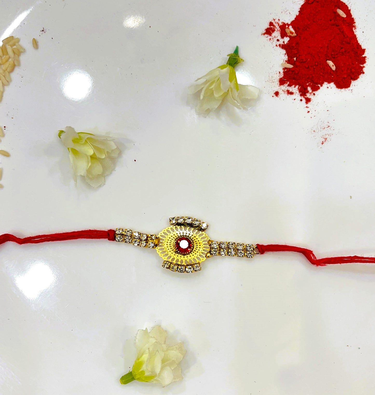 RED ZIRCON FLOWE RAKHI