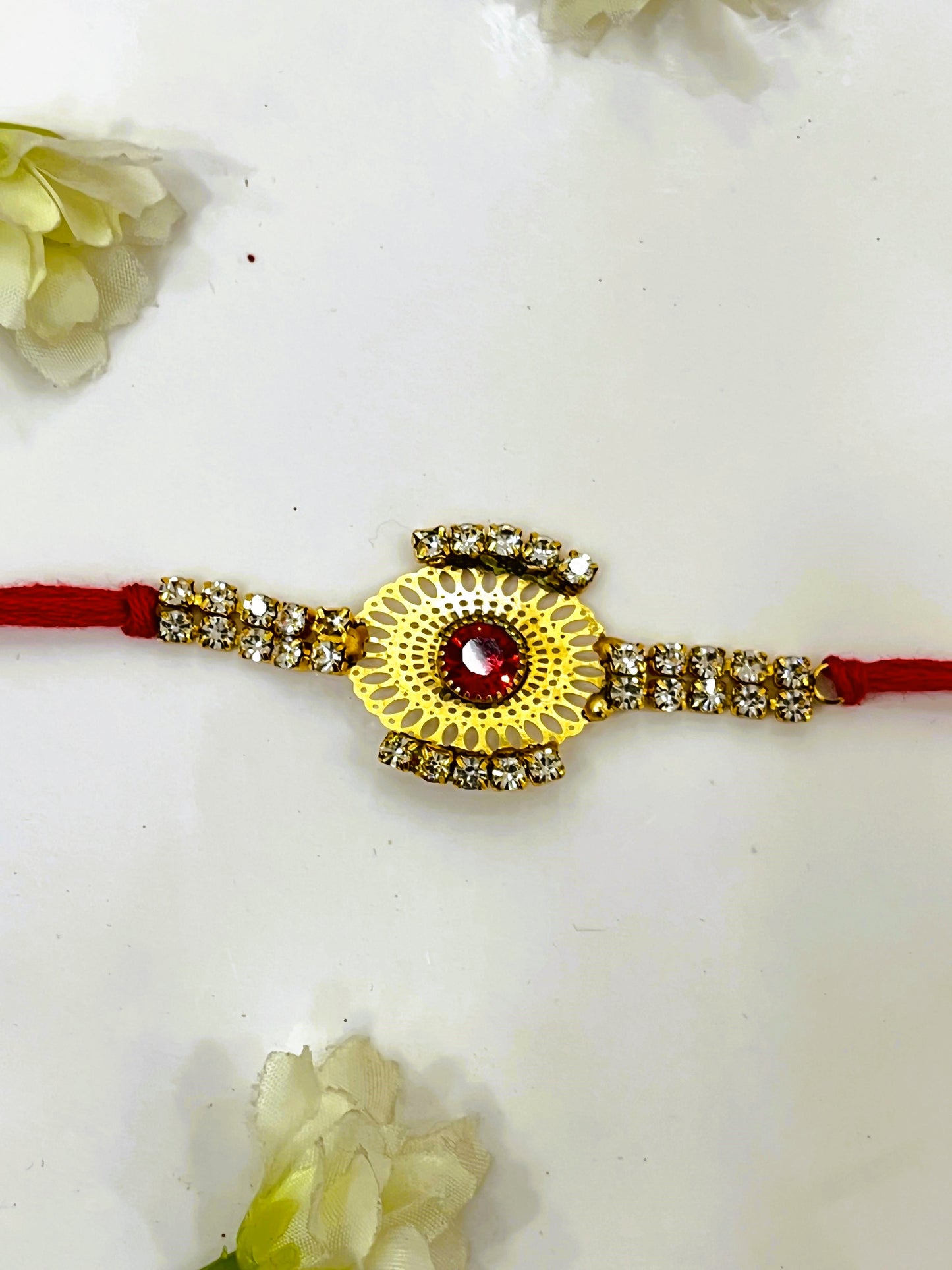 RED ZIRCON FLOWE RAKHI