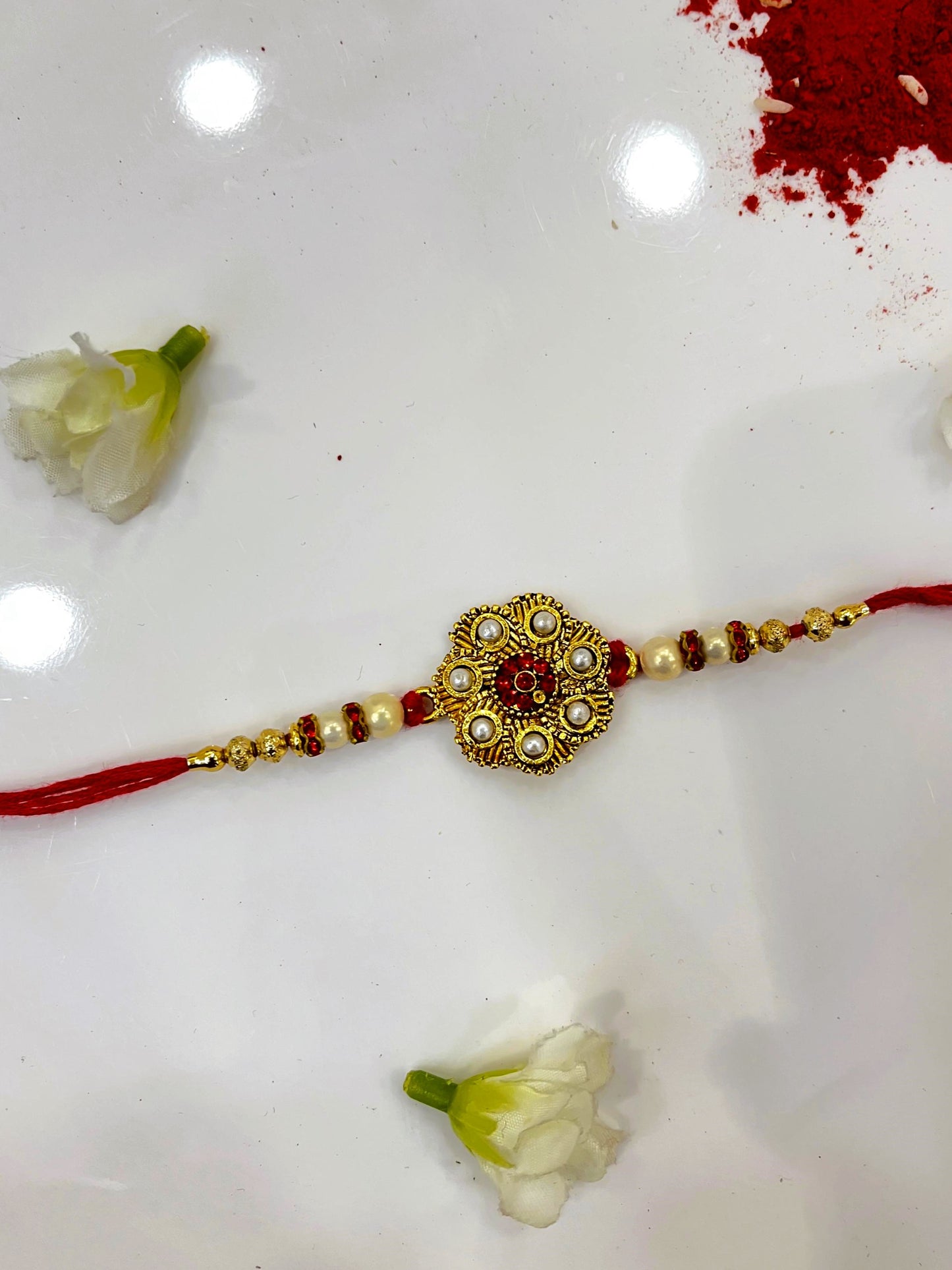 small pearl red kundan rakhi