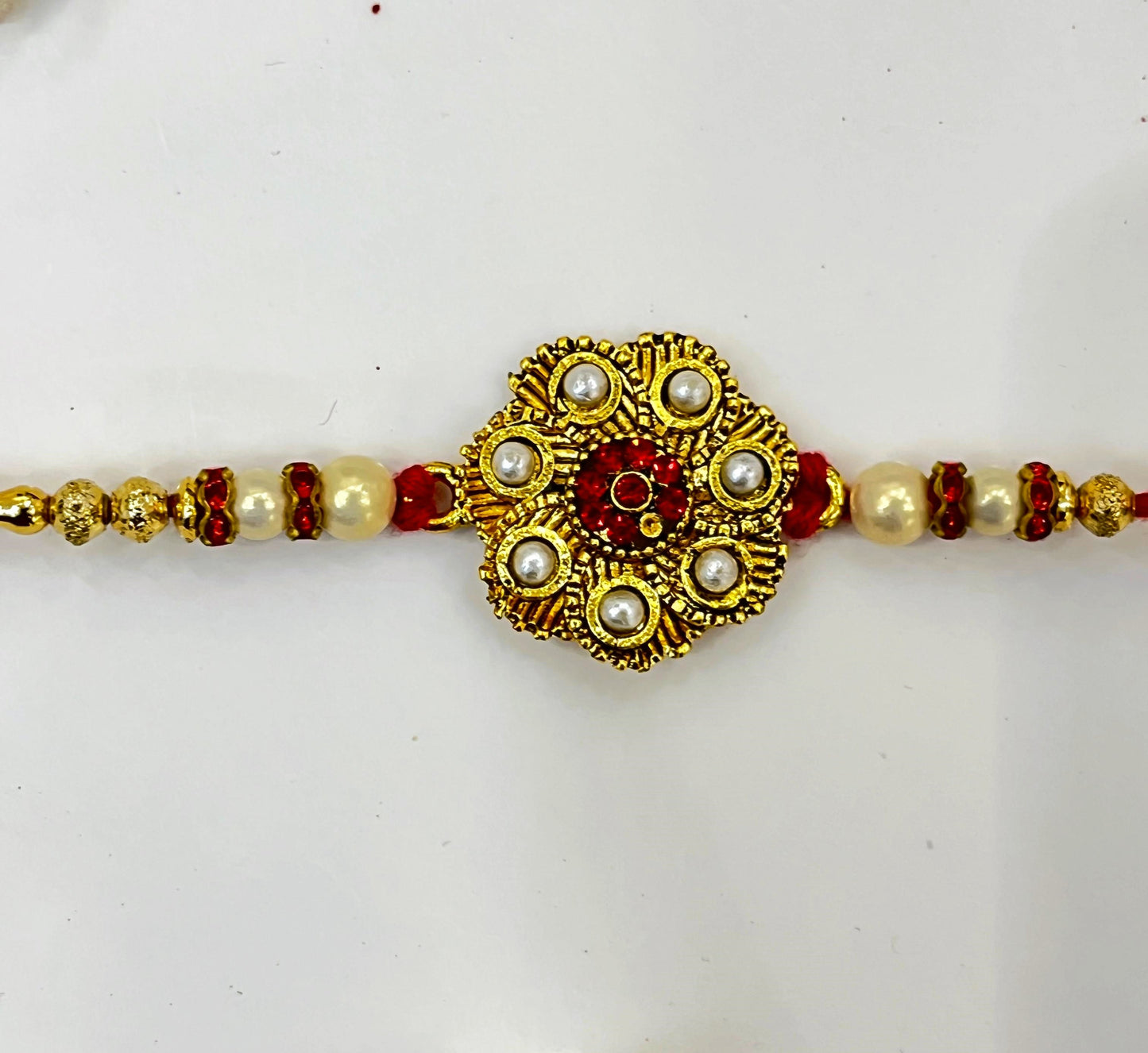 small pearl red kundan rakhi