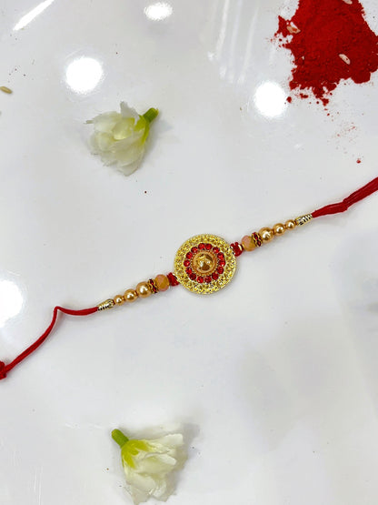 GOLD CIRCLE RED STONE RAKHI