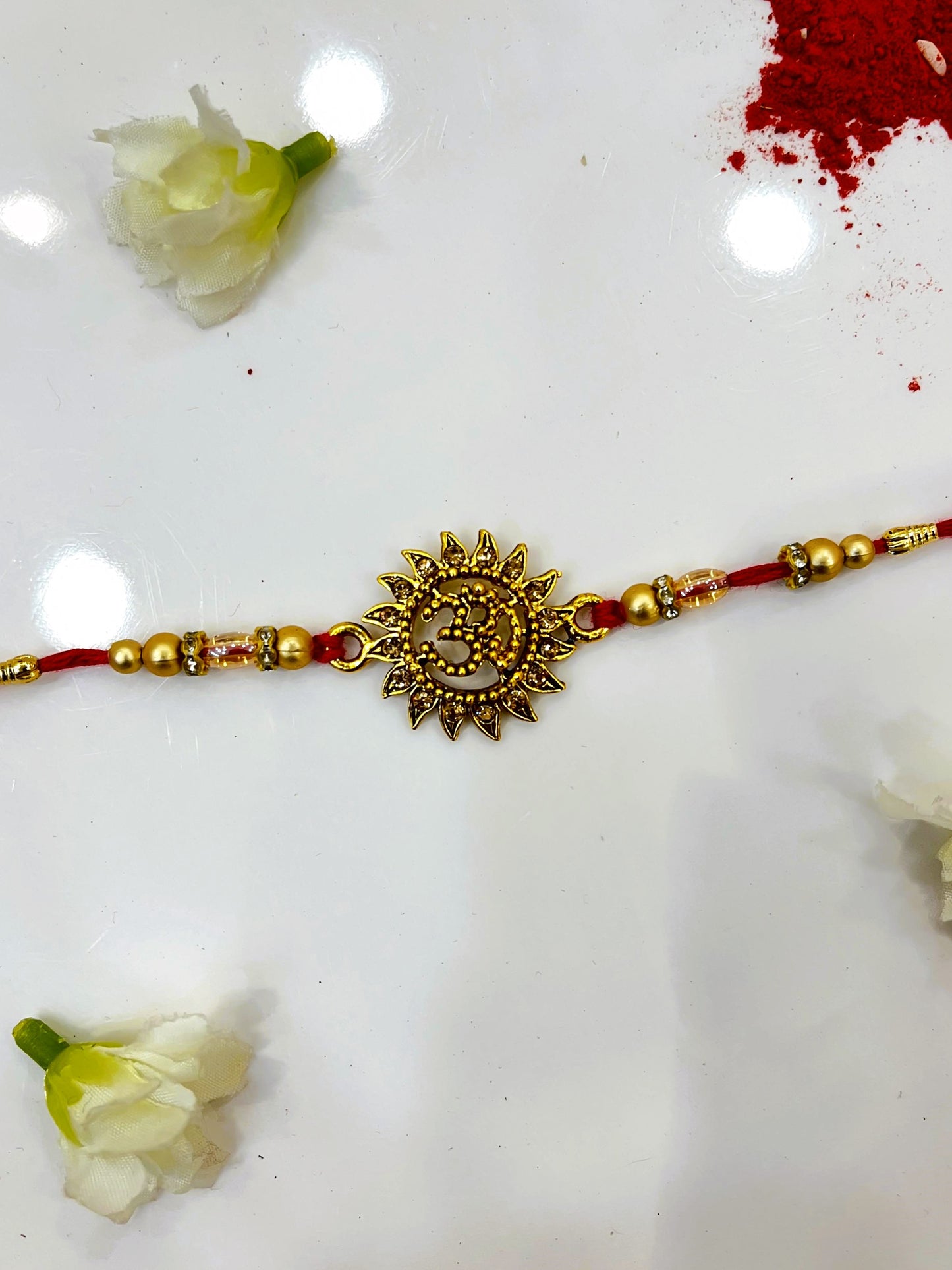 OM GOLD RAKHI