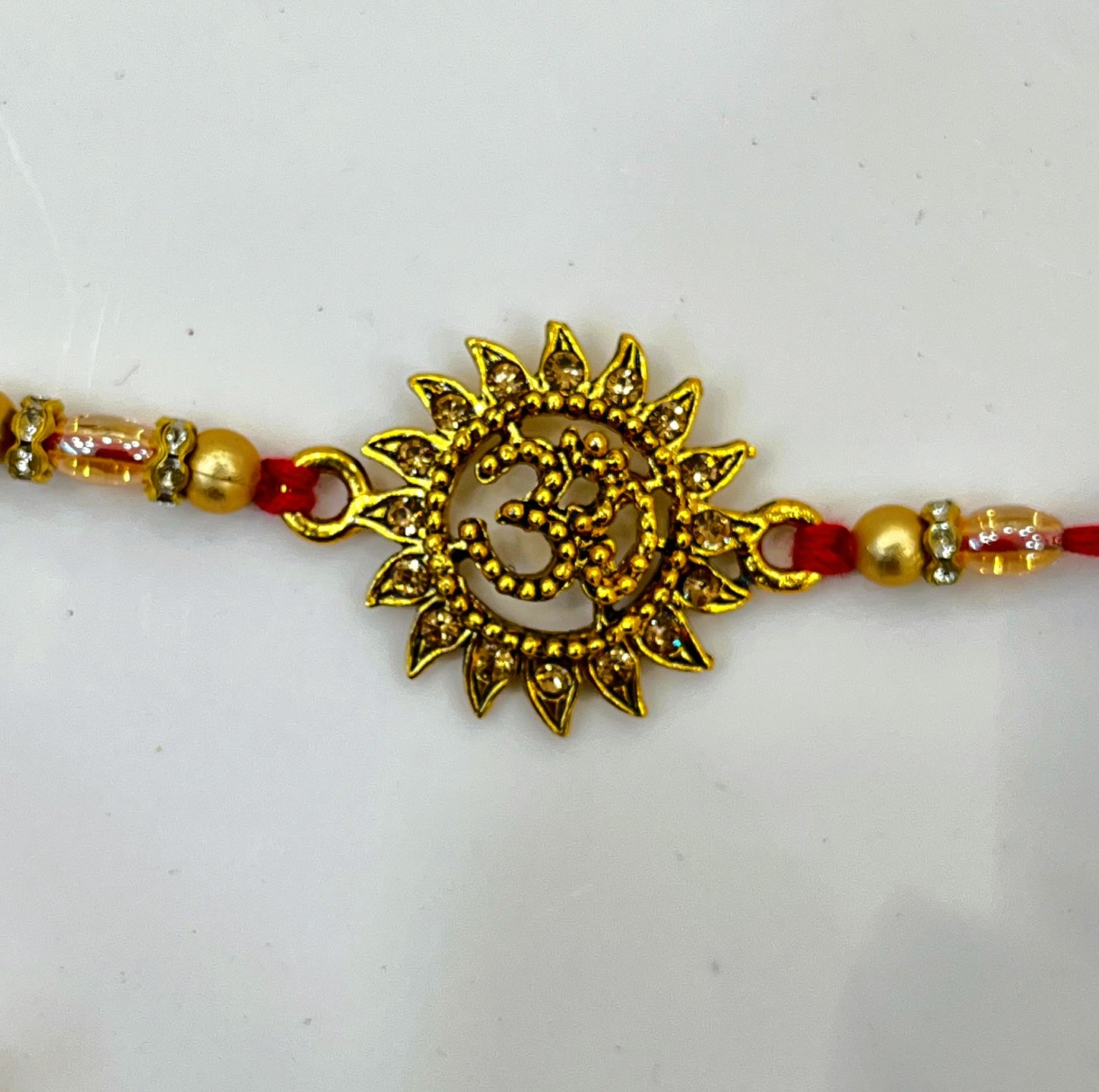 OM GOLD RAKHI